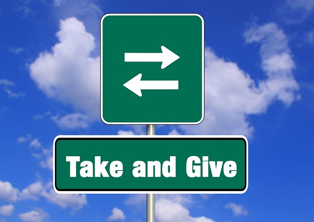 I mage showing a take give sign Image showing a take give sign